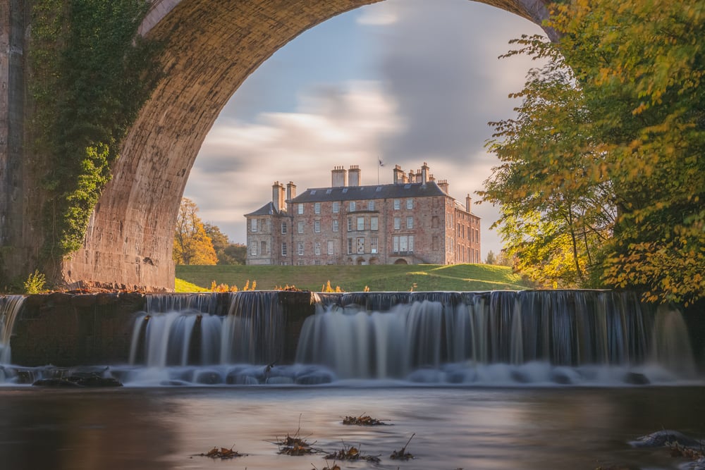 Historic UK property with architectural features, showcasing the elegance of a restored heritage estate